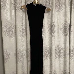 Mid length black dress with cutouts in the back